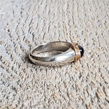 Ring with a cabochon sapphire made with 925 silver and 22 kt gold