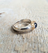 Ring with a cabochon sapphire made with 925 silver and 22 kt gold