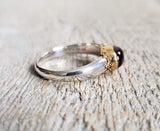 Ring with a pink tourmaline cabochon made with 925 silver and 22 kt gold