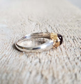 Ring with a pink tourmaline cabochon made with 925 silver and 22 kt gold