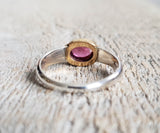 Ring with a pink tourmaline cabochon made with 925 silver and 22 kt gold