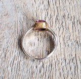 Ring with a pink tourmaline cabochon made with 925 silver and 22 kt gold