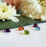 Lot: Garnet, Rhodolite Garnet, Amethyst, Sky blue Topaz and Peridot