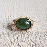Ring with green tourmaline made with 925 silver and 22 kt gold 