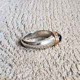 Ring with a cabochon sapphire made with 925 silver and 22 kt gold 